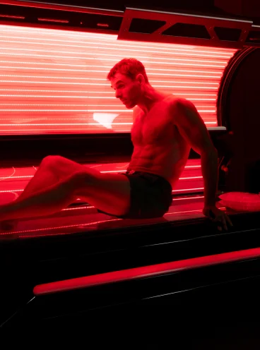 Male about to start red light therapy treatment session Male about to start red light therapy treatment session