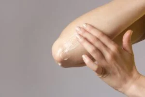 Woman,applying,elbow,cream.,beauty,and,body,care.,winterizing,dry Woman,applying,elbow,cream.,beauty,and,body,care.,winterizing,dry