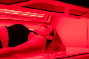 Woman lying in a full-body red light therapy bed in Dundrum, Dublin. Woman lying in a full-body red light therapy bed in Dundrum, Dublin.