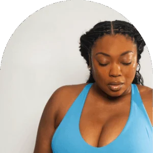 Customer with healthy, glowing skin following a WellFit Hydrate full-body skincare treatment.