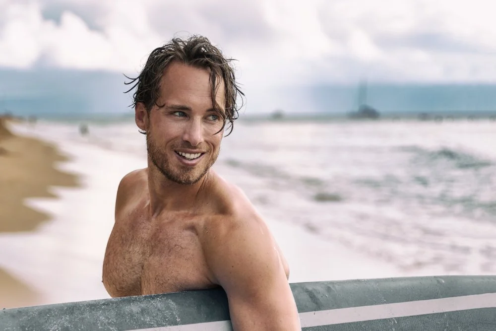 Man with healthy, dewy skin at the seaside – the kind of glow supported by WellFit Hydrate.