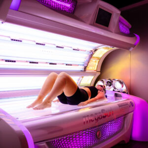 The Tanning Shop Ireland customer using a premium lay-down sunbed
