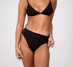 Woman in black underwear showing tan lines following a Norvell spray tan. Woman in black underwear showing tan lines following a Norvell spray tan.